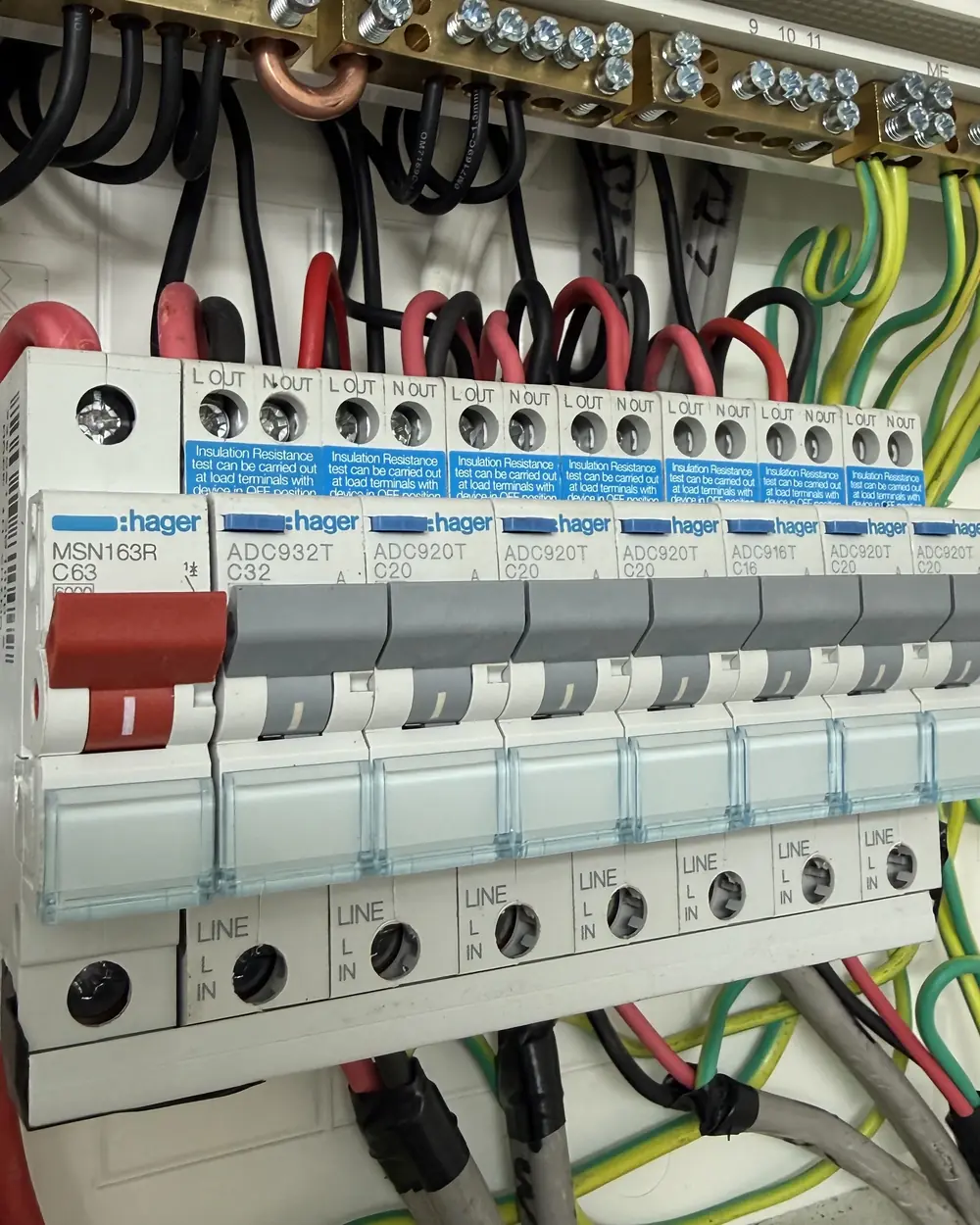 Licensed Gold Coast electrician working on a home switchboard